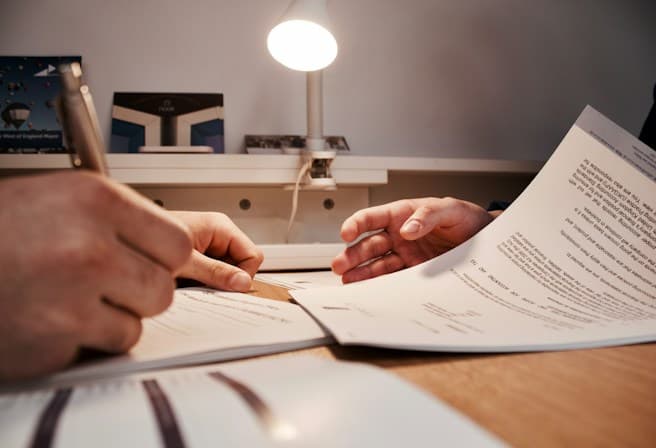 Consultant reviewing a quality management system document aligned with ISO 13485
